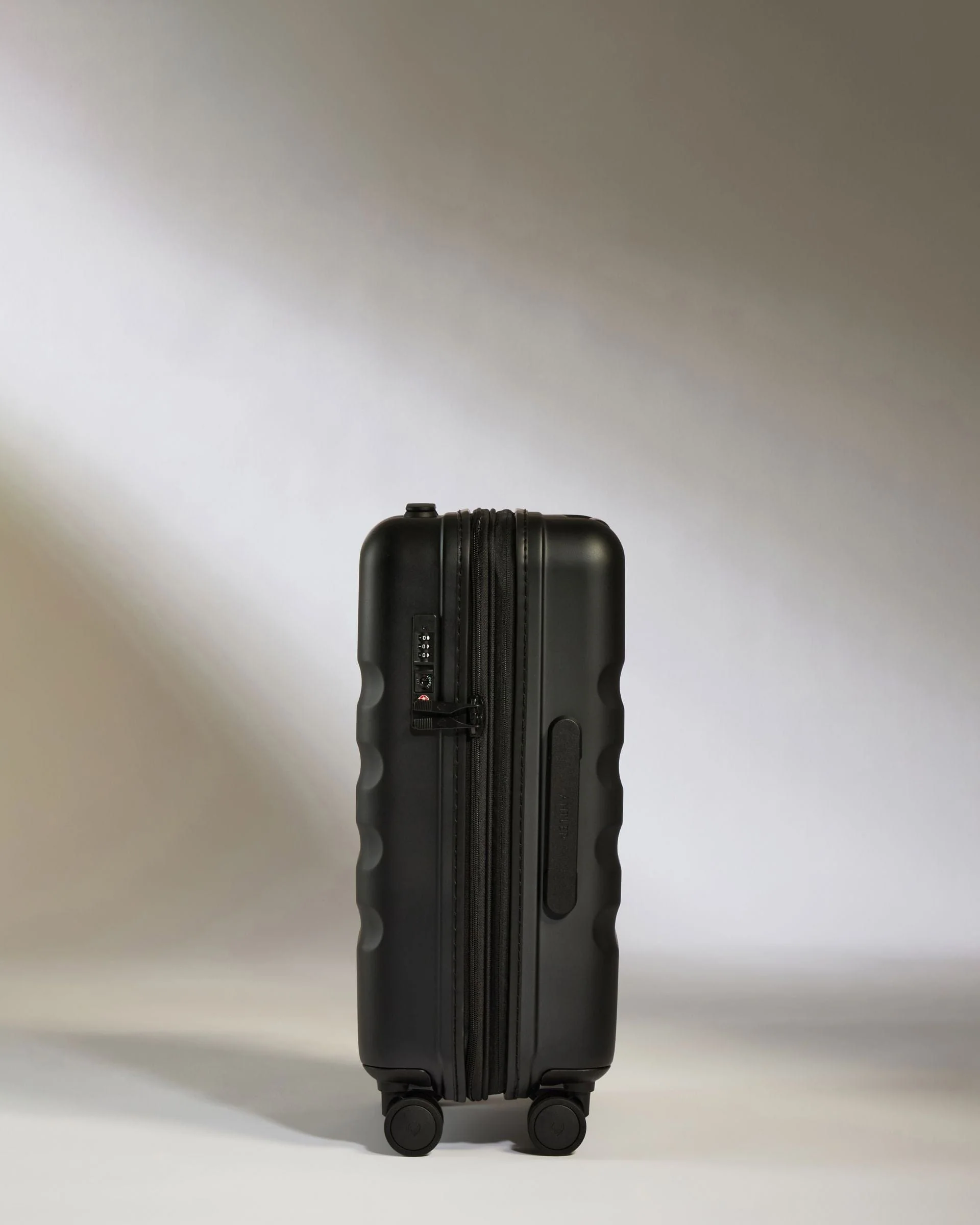 Expandable Cabin Suitcase in Black - Icon Stripe - Image 4