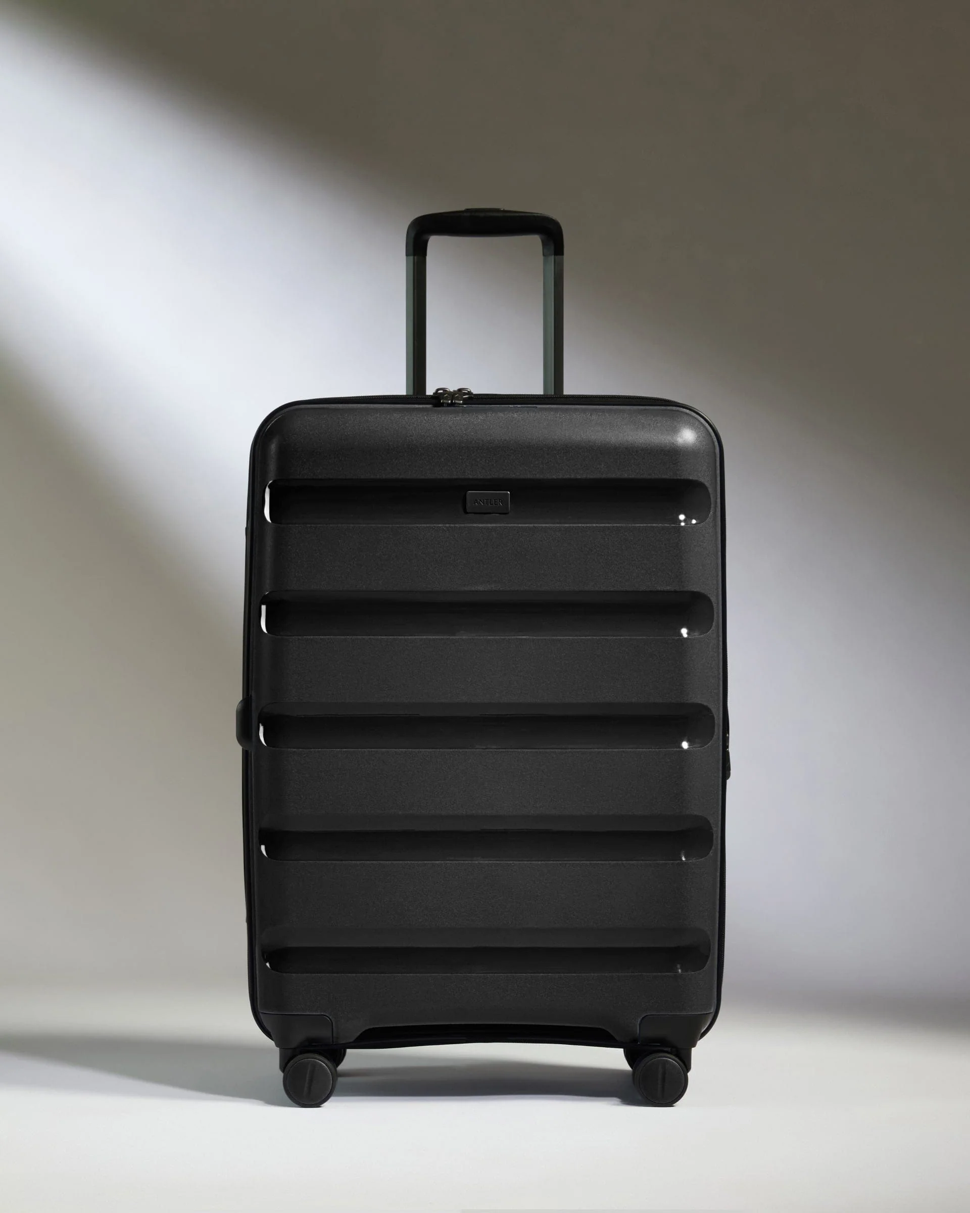 Medium Suitcase in Black - Logo Stripe - Image 5
