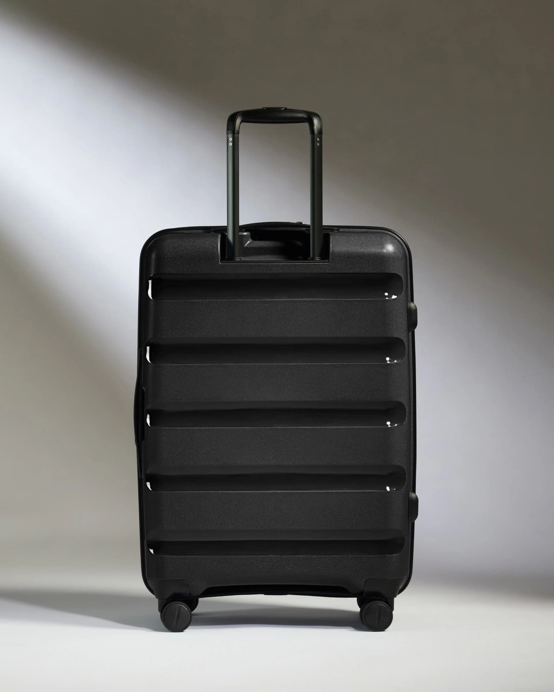 Medium Suitcase in Black - Logo Stripe - Image 6